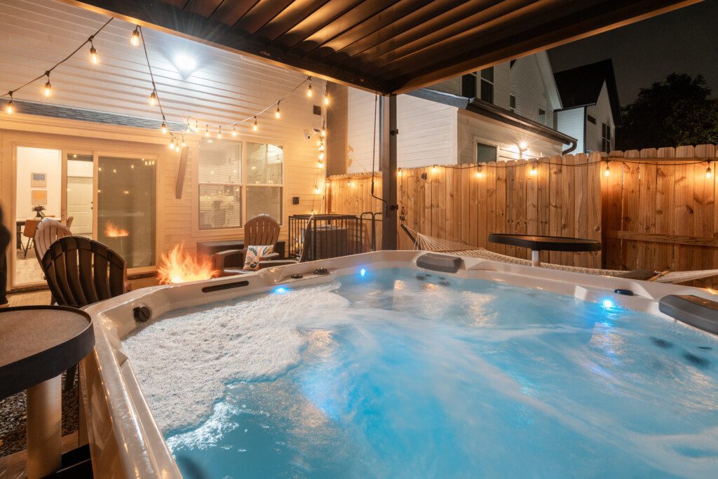 Outdoor hot tub surrounded by greenery