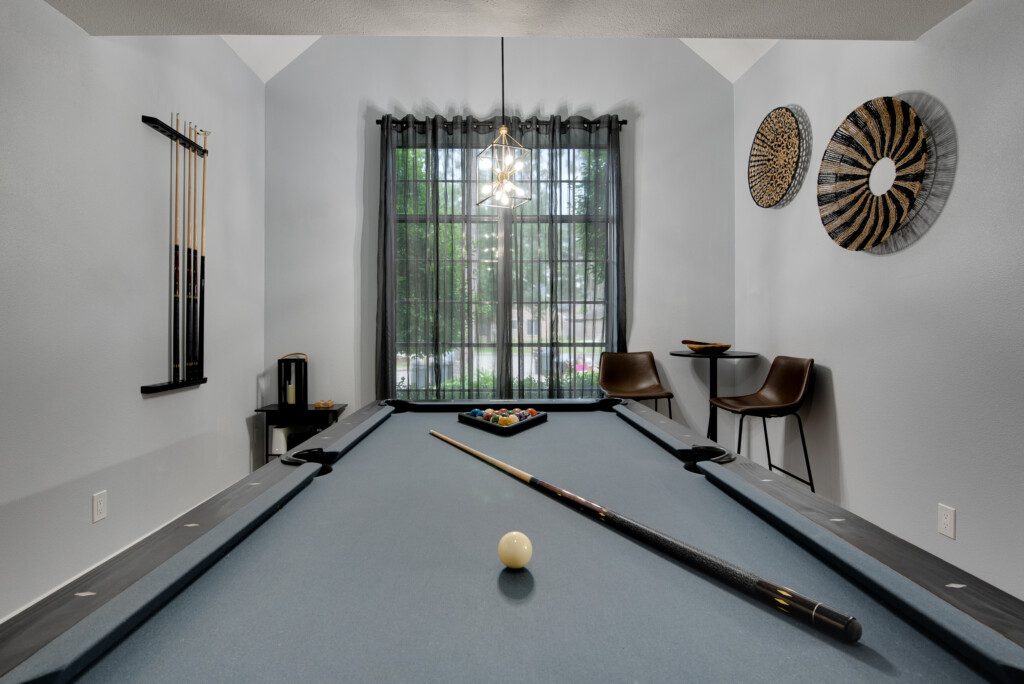 Modern game room with pool table and stylish decor at Destination Pine Walk, Spring TX
