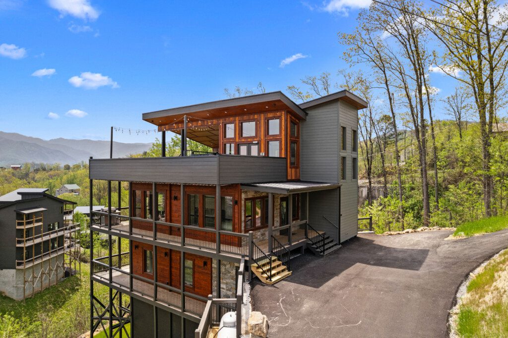 Family vacation rental: modern Smoky Mountains cabin with rooftop deck and long-range mountain views near Gatlinburg.