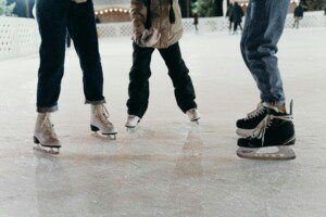 Family ice skating at The Woodlands Ice Rink near Spring, TX during the holiday season