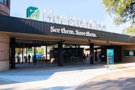 Houston Zoo main entrance with "See them. Save them." sign in Hermann Park, Houston
