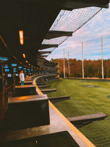 Topgolf Houston North hitting bays with climate-controlled seating and driving range in Spring Texas