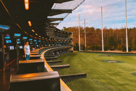 Topgolf Houston North hitting bays with climate-controlled seating and driving range in Spring Texas