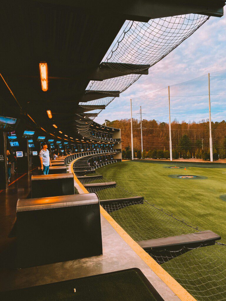 Topgolf Houston North hitting bays with climate-controlled seating and driving range in Spring Texas