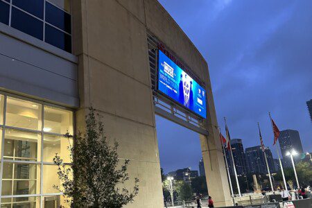 Toyota Center arena exterior at dusk in downtown Houston during Muse concert