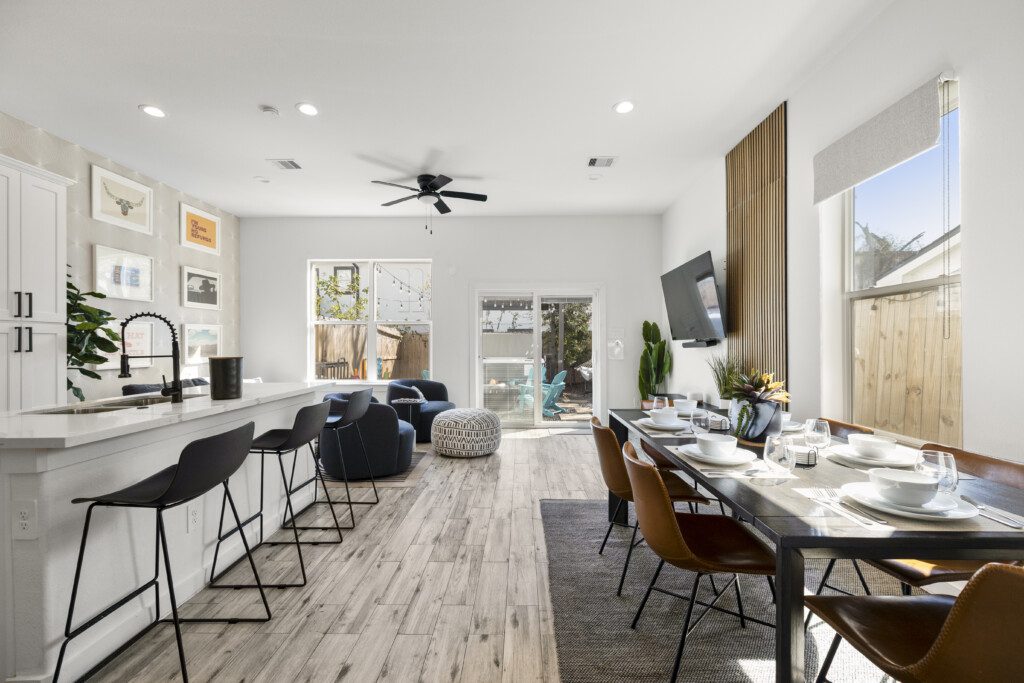 Full open-concept dining, kitchen, and living room at The Landing Pad Houston vacation rental near NRG Stadium