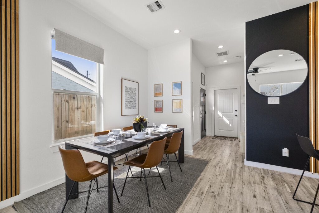 Open concept dining area at The Landing Pad Houston vacation rental with dining table for six near NRG Stadium