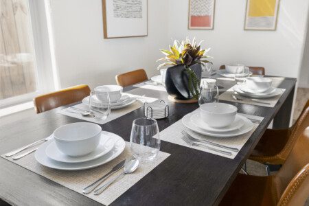 Dining table set for six at The Landing Pad Houston vacation rental near NRG Stadium