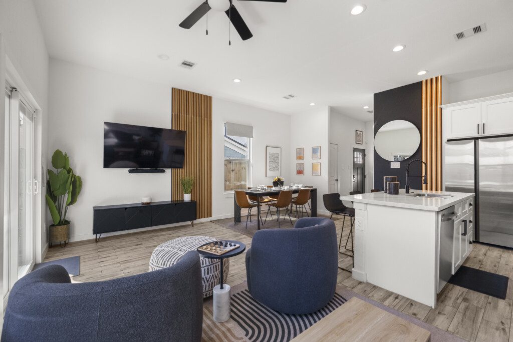 Open concept living room, dining area, and kitchen at The Landing Pad Houston vacation rental near NRG Stadium