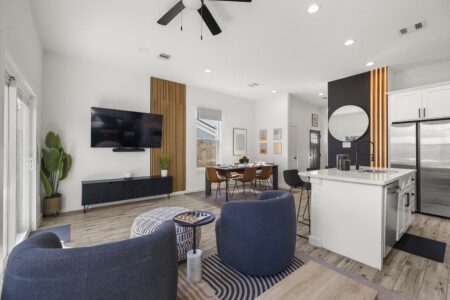 Open concept living room, dining area, and kitchen at The Landing Pad Houston vacation rental near NRG Stadium
