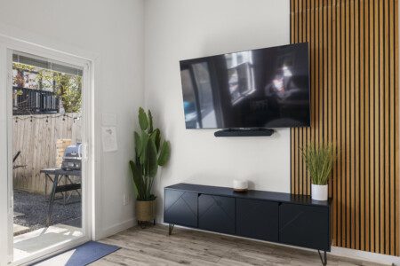 Modern living room with Smart TV and backyard access at The Landing Pad Houston vacation rental near NRG Stadium