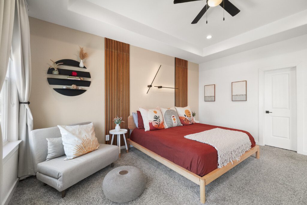 Spacious guest bedroom with seating area at The Landing Pad Houston vacation rental near NRG Stadium